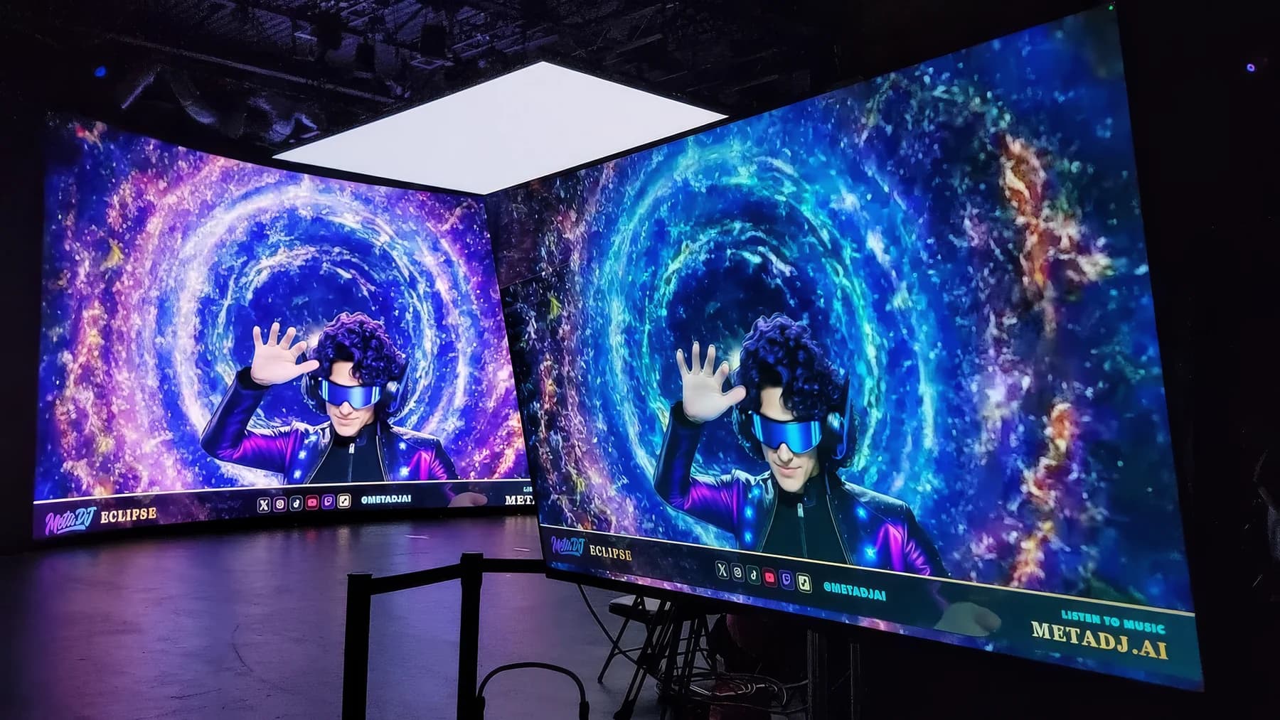Two venue screens show a blue-violet portal and the MetaDJ avatar beneath rectangular ceiling lights.