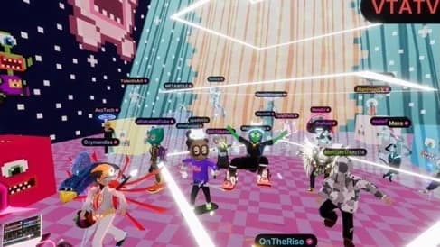 A crowd of avatars gathers beneath bright stage beams and pixel-like decorations.